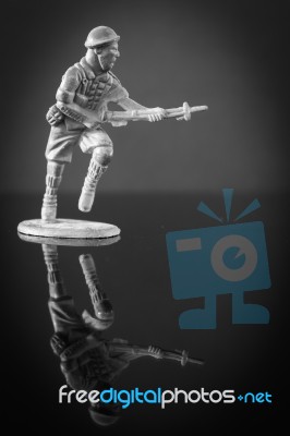 Mini Toy Soldier On Black Background Stock Photo