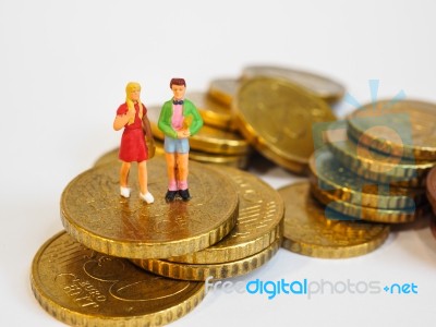 Miniature Children Stand On Euro Coins. Family Future Money Plan… Stock Photo