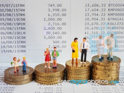 Miniature Family Stand On Pile Of Euro Coins And Book Bank. Fami… Stock Photo