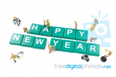 Miniature Worker Team Building Word Happy New Year On White Back… Stock Photo