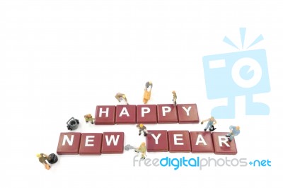 Miniature Worker Team Building Word Happy New Year On White Back… Stock Photo