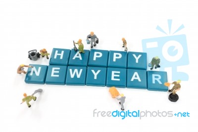 Miniature Worker Team Building Word Happy New Year On White Background Stock Photo Miniature Worker Team Building Word Happy New Year On White Background Stock Photo