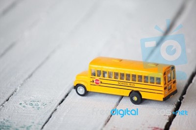 Minimal School Bus On Wooden Panel Stock Photo
