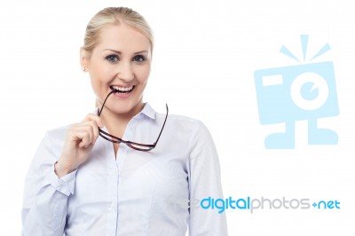 Mischievous Smiling Young Corporate Woman Stock Photo