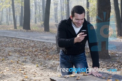 Mobil Phone And Man With Smile Stock Photo