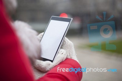 Mobile Phone In Hands With Glowes, Cold Weather Stock Photo