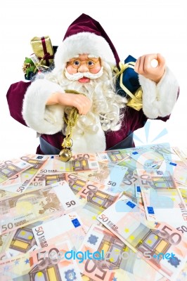 Model Of Santa Claus With Gifts And Euro Money Stock Photo