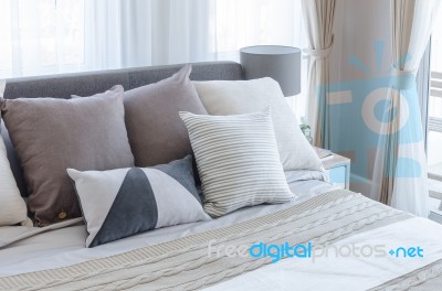 Modern Bedroom With Pillows On Bed Stock Photo