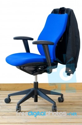 Modern Blue Office Chair With Jacket On Back Stock Photo