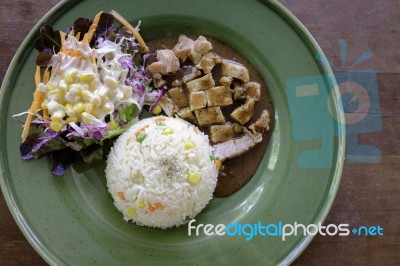 Modern Thai Pork Pepper Sauce With Jasmin Rice And Salad Stock Photo