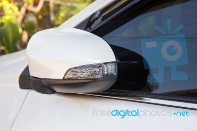 Modern White Car Side View Mirror Folded With Turn Signal Stock Photo