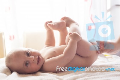 Mom Carefully Clean Baby Skin With Wet Wipes Stock Photo