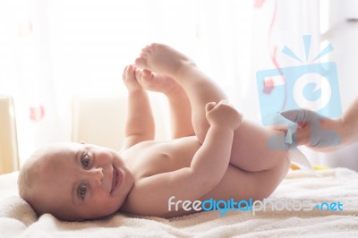 Momy Cleaning Baby Skin With Wet Wipes Stock Photo