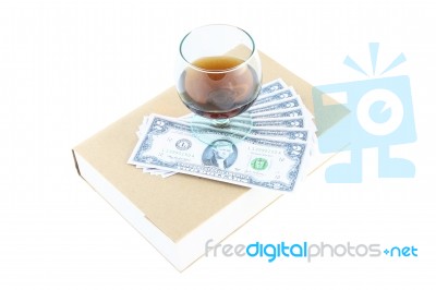 Money And Wine On Book Stock Photo