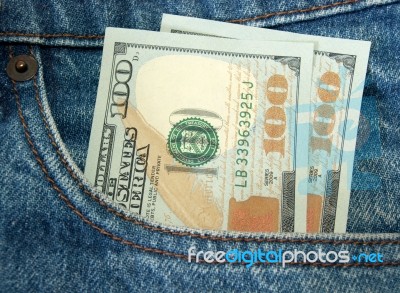 Money In Jeans Pocket Stock Photo