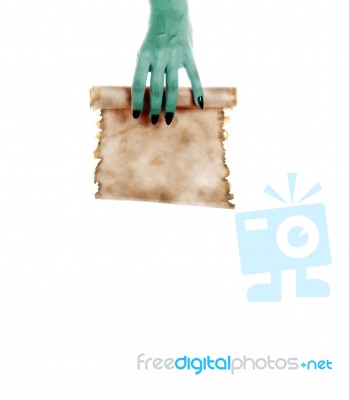 Monster Hand Holding A Folded Roll Of Old Paper (letter Or Invit… Stock Photo