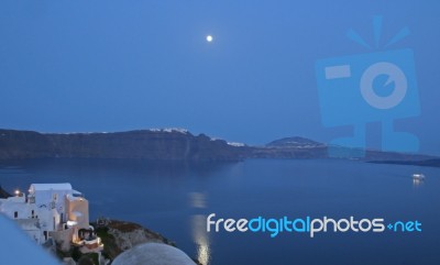 Moonrise Over Santorini Stock Photo