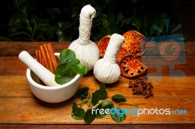 Mortar And Pestle With Herbs Stock Photo