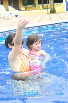 Mother And Baby In Swimming Pool Stock Photo