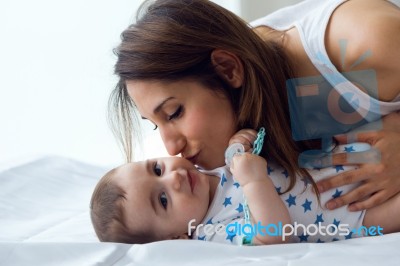 Mother And Baby Playing And Smiling At Home Stock Photo