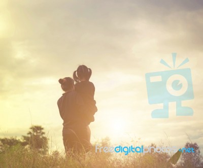 Mother And Daughter On Sunset Watching On Sky Stock Photo Mother And Daughter On Sunset Watching On Sky Stock Photo