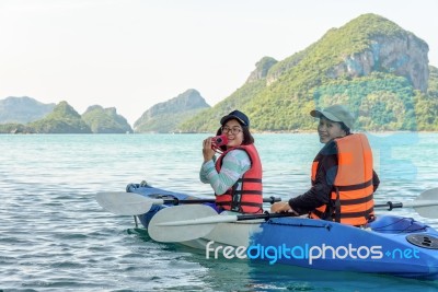 Mother And Daughter Take Pictures On Kayak Stock Photo