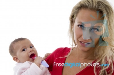 Mother With Her Baby Looking At Camera Stock Photo