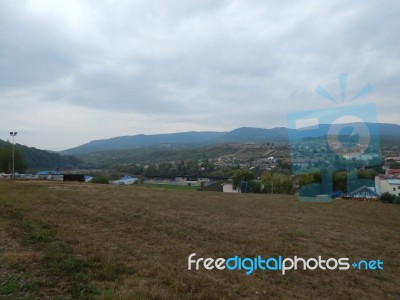Mountain Panorama, Landscape And Buildings Stock Photo