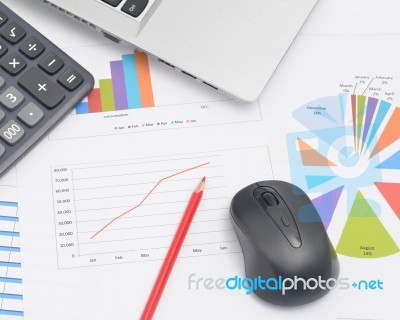 Mouse Computer And Financial Graphs Stock Photo