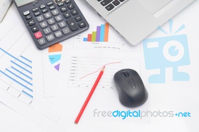 Mouse Computer And Financial Graphs Stock Photo