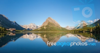 Mt Wilbur And Reflection At Swiftcurrent Lake In Glacier Nationa… Stock Photo