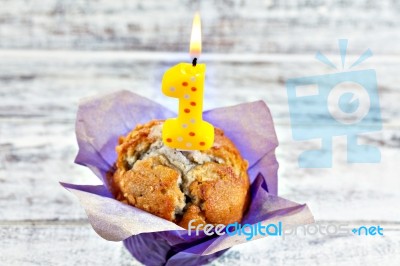 Muffin With Burning Candle Stock Photo