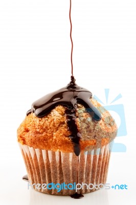 Muffin With Liquid Chocolate Stock Photo