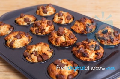 Muffins With Chocolate Chips In Baking Tray Stock Photo