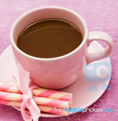 Mug Of Freshly Brewed Coffee And Some Strawberry Cookie Sticks Stock Photo