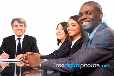 Multi Ethnic Team During Meeting Stock Photo