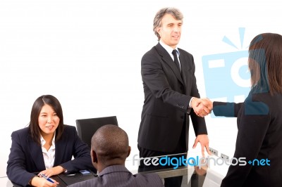 Multi Ethnic Team During Meeting Stock Photo