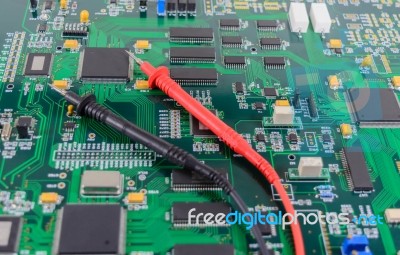 Multimeter Test Probes On Printed Circuit Board Stock Photo