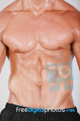 Muscular And Tanned Male Naked Torso Stock Photo