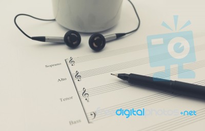 Music Sheet Earphone And Cup Stock Photo