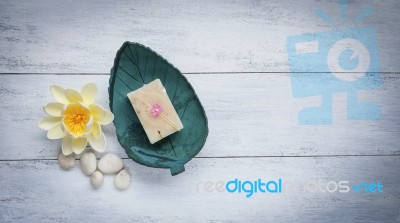 Natural Soap Bar On Coconut Shell Dish Stock Photo