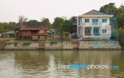 New And Old House Style Waterfront Stock Photo