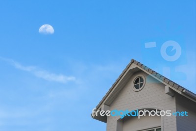 New Traditional Gable Roof  House Under Moon Sky Stock Photo