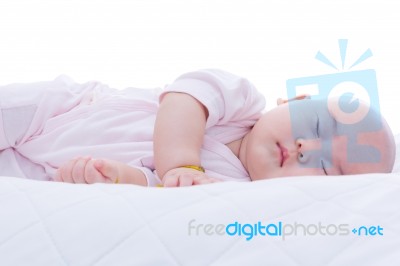 Newborn Baby Girl Sleeping In Bed Stock Photo