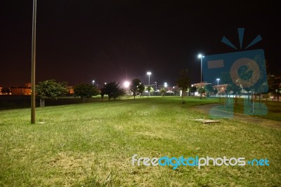 Night Public Park In The City With Houses Near Stock Photo