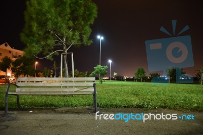 Night Public Park In The City With Houses Near Stock Photo