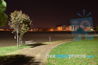 Night Public Park In The City With Houses Near Stock Photo