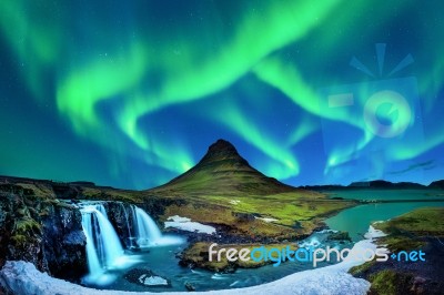 Northern Light, Aurora Borealis At Kirkjufell In Iceland. Kirkjufell Mountains In Winter Stock Photo