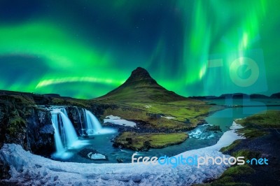 Northern Light, Aurora Borealis At Kirkjufell In Iceland. Kirkjufell Mountains In Winter Stock Photo