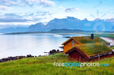 Norway Island In Fjord. Cloudy Nordic Day. Hotel On Island Stock Photo
